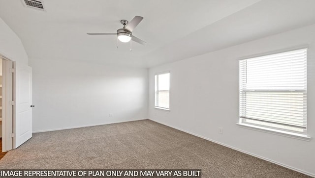 carpeted empty room with ceiling fan and vaulted ceiling