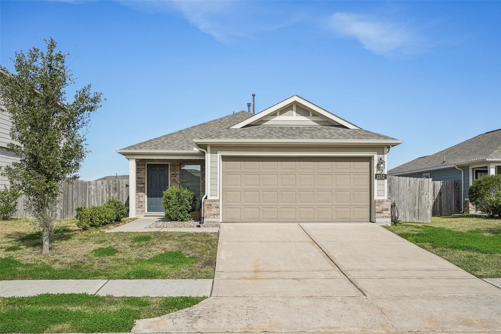 ranch-style home featuring a front yard and a garage