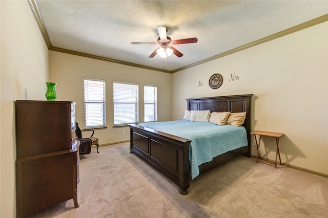 carpeted bedroom featuring a textured ceiling, ceiling fan, and ornamental molding