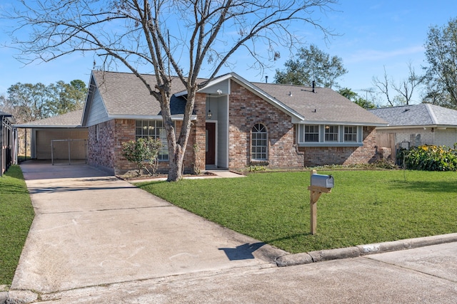 ranch-style home featuring a garage and a front lawn