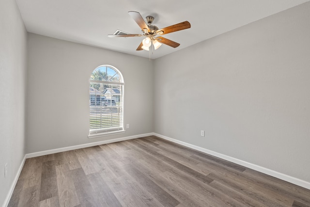 unfurnished room featuring hardwood / wood-style floors and ceiling fan