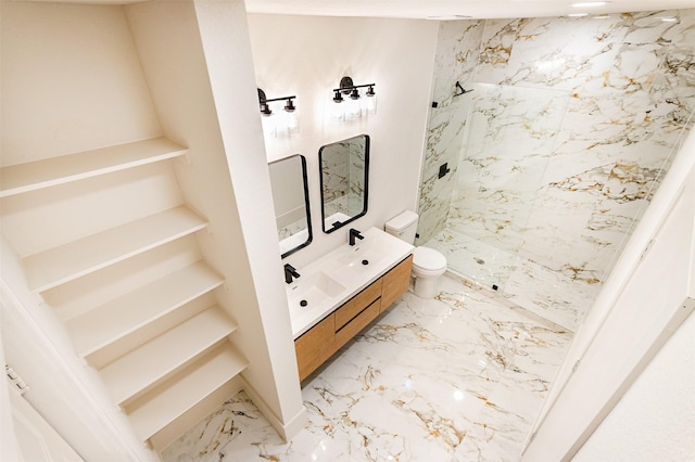 bathroom with vanity, toilet, and a shower