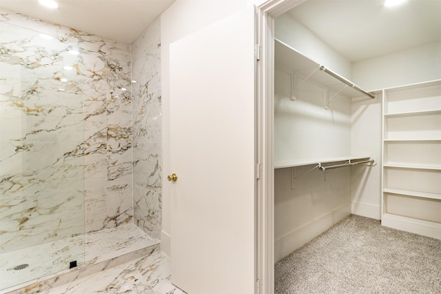 bathroom with tiled shower