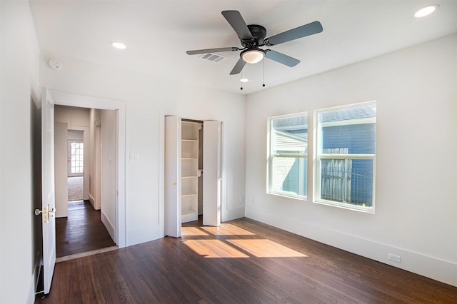 unfurnished bedroom with dark hardwood / wood-style floors and ceiling fan