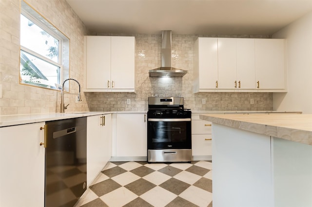 kitchen with stainless steel range, white cabinets, wall chimney range hood, and black dishwasher