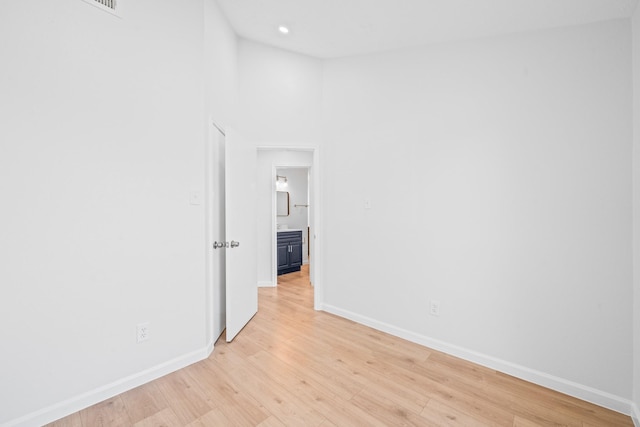 spare room with light hardwood / wood-style floors