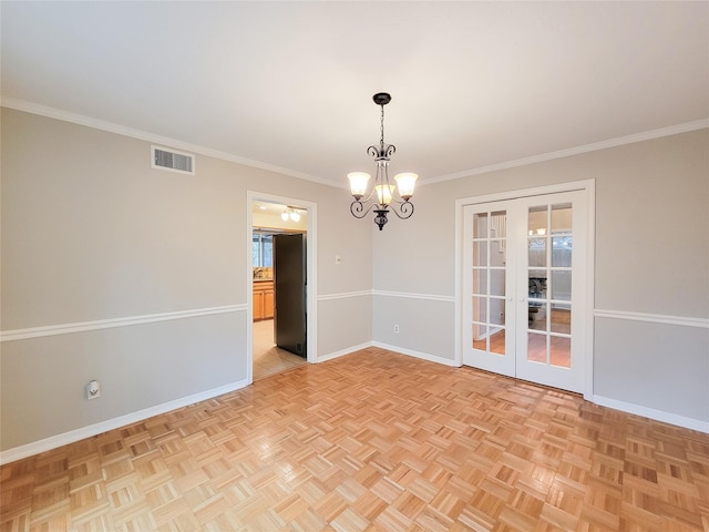 unfurnished room featuring a chandelier, crown molding, and light parquet floors