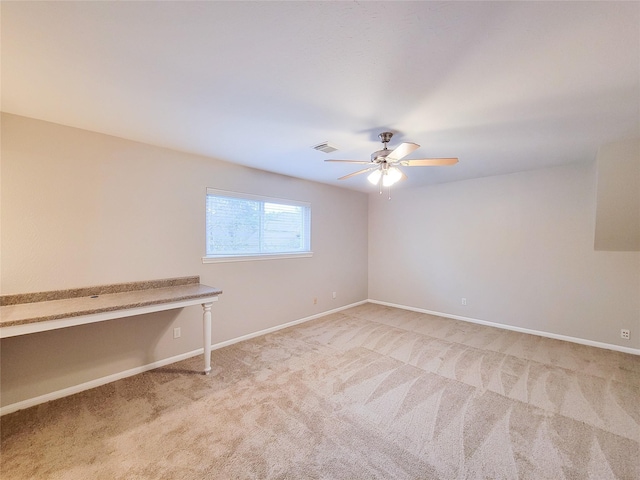 carpeted empty room with ceiling fan