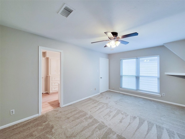 unfurnished bedroom with ceiling fan and light carpet