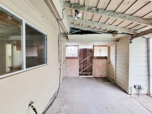 exterior space featuring wood walls and wooden ceiling