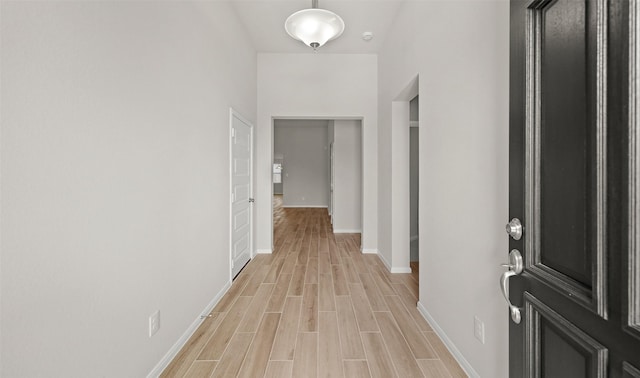 hallway with light wood-type flooring