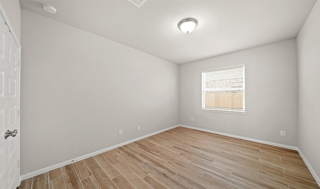 spare room with light wood-type flooring