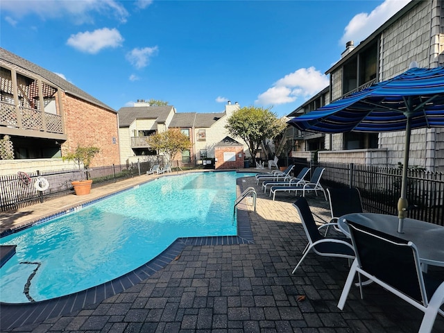 view of pool featuring a patio area