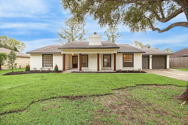 ranch-style home with a garage, covered porch, and a front lawn