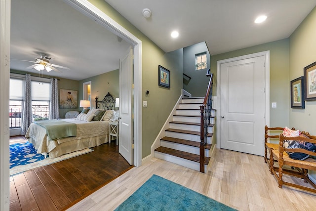 bedroom with light hardwood / wood-style floors and ceiling fan