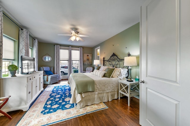 bedroom with ceiling fan and dark hardwood / wood-style flooring