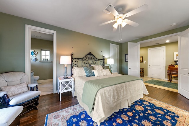 bedroom featuring connected bathroom, dark hardwood / wood-style flooring, and ceiling fan