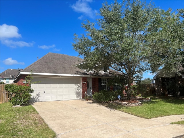 view of front of home with a garage and a front lawn