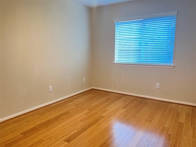 empty room with light hardwood / wood-style floors