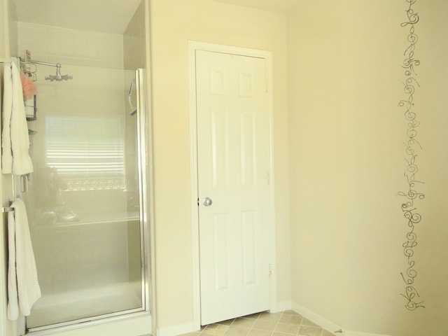 bathroom featuring tile patterned floors and walk in shower