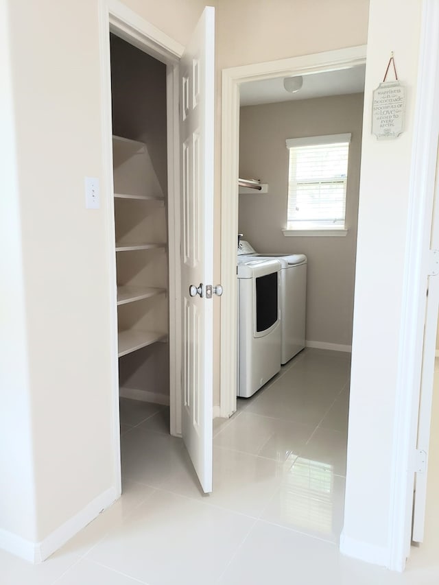 washroom with light tile patterned floors and independent washer and dryer