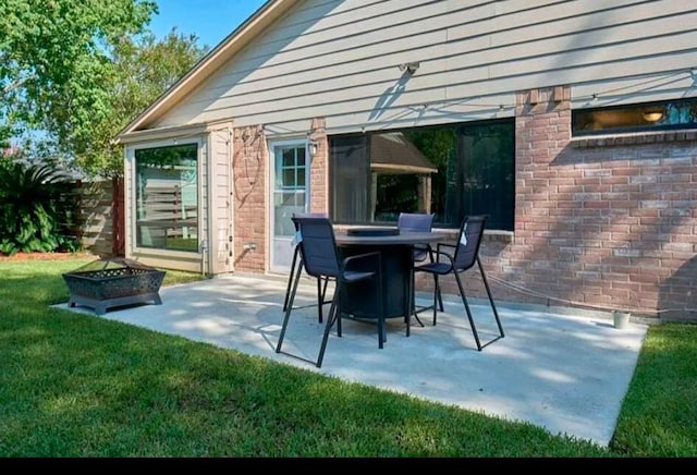 view of patio / terrace featuring an outdoor fire pit