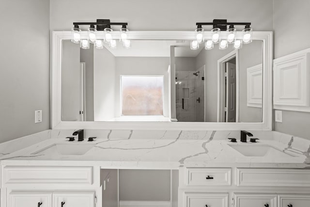 bathroom with vanity and a shower with shower door