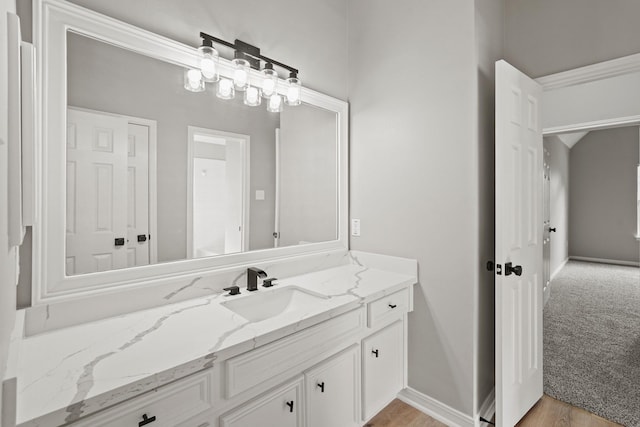 bathroom featuring vanity and hardwood / wood-style flooring