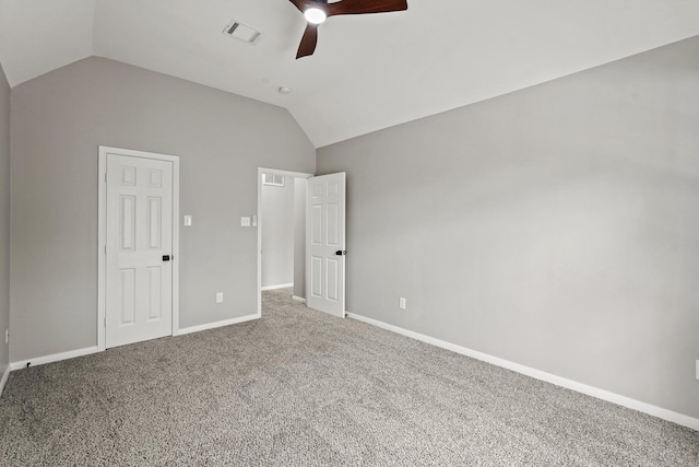 unfurnished bedroom featuring ceiling fan, a closet, carpet floors, and vaulted ceiling