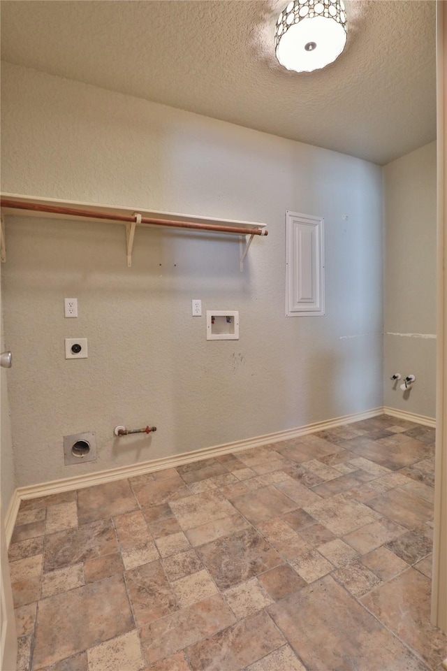 laundry room featuring washer hookup, electric dryer hookup, gas dryer hookup, and a textured ceiling