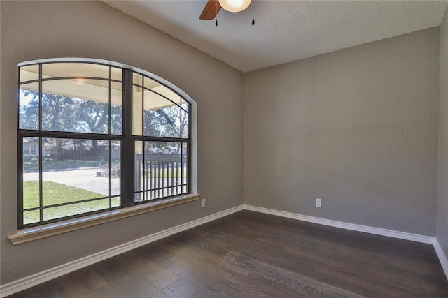 unfurnished room with dark hardwood / wood-style flooring, vaulted ceiling, and ceiling fan