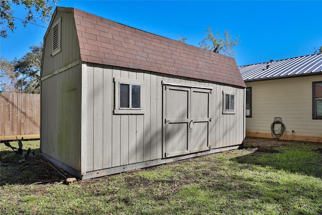 view of outbuilding with a lawn