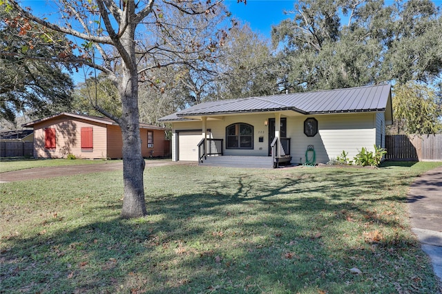 ranch-style house with a garage, a porch, and a front yard