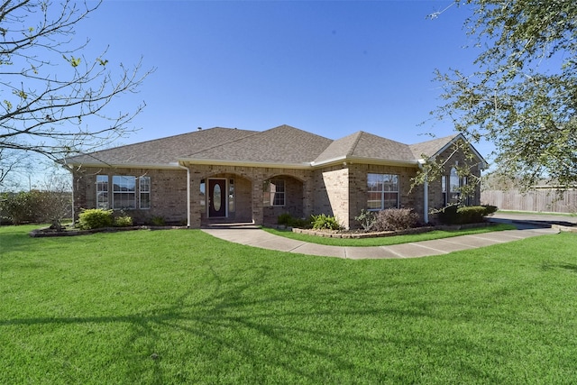 ranch-style house featuring a front lawn