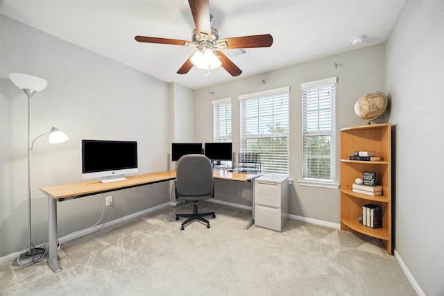 home office featuring ceiling fan and light colored carpet