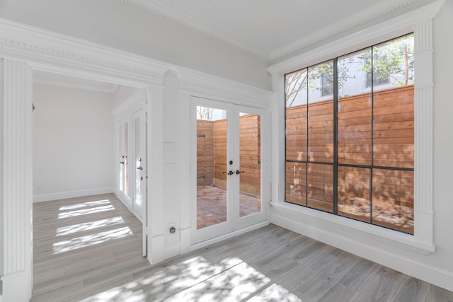 unfurnished sunroom featuring french doors