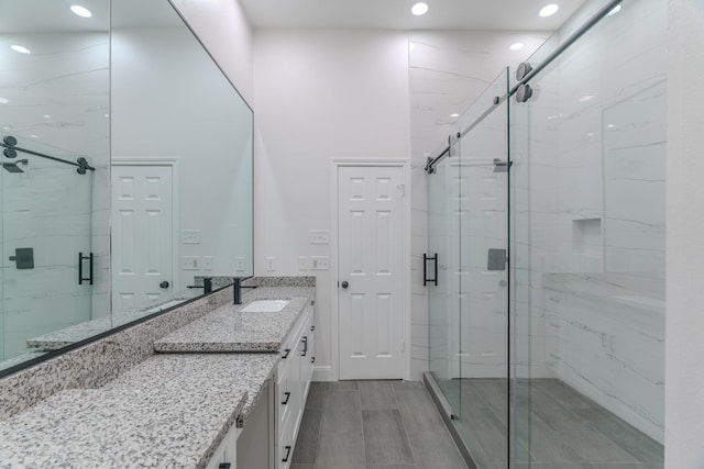 bathroom with vanity and an enclosed shower