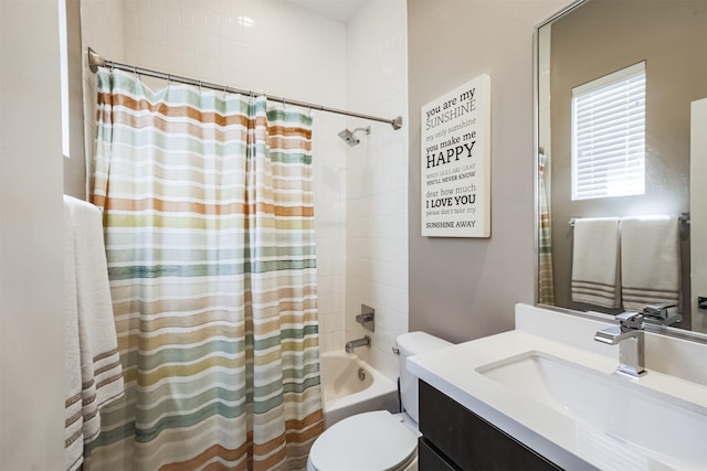 full bathroom with vanity, shower / bath combo, and toilet