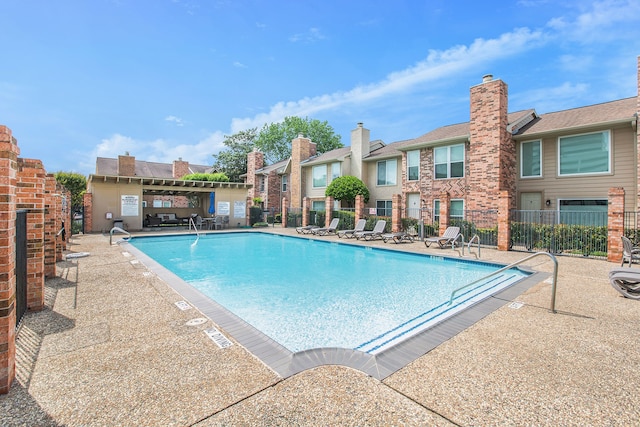 view of swimming pool with a patio