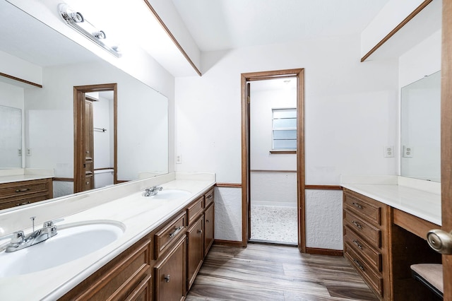 bathroom featuring hardwood / wood-style floors and vanity