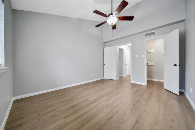 unfurnished bedroom with vaulted ceiling, light hardwood / wood-style flooring, and ceiling fan