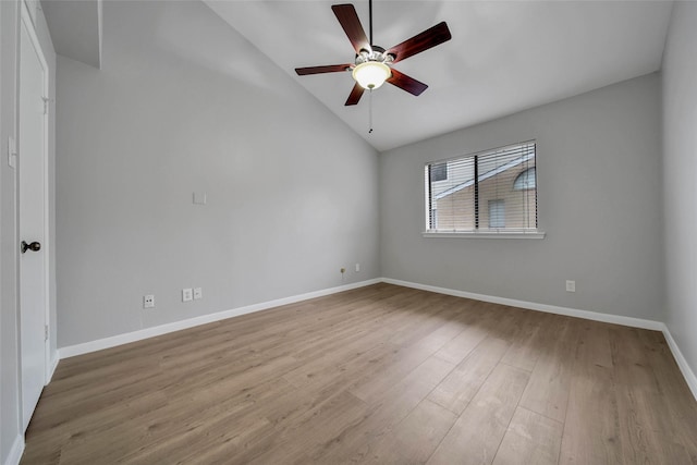 spare room featuring ceiling fan, vaulted ceiling, and light hardwood / wood-style flooring