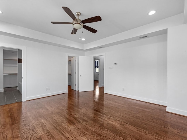 interior space with dark hardwood / wood-style floors and ceiling fan