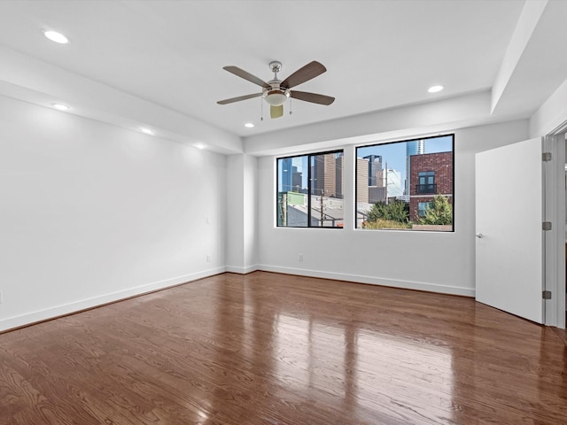 unfurnished room with wood-type flooring and ceiling fan