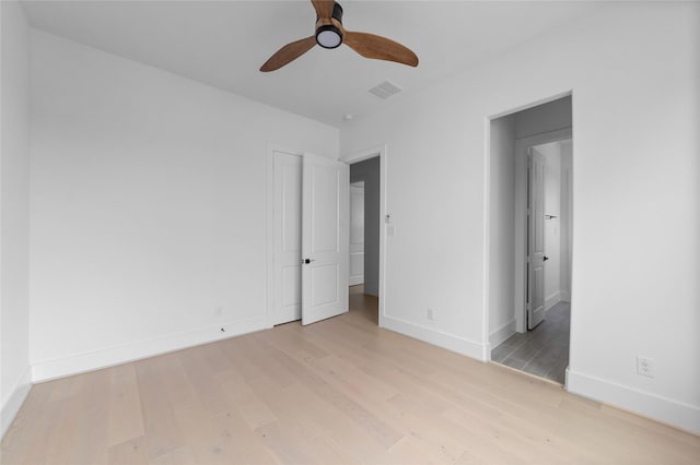 unfurnished bedroom featuring ceiling fan and light hardwood / wood-style flooring