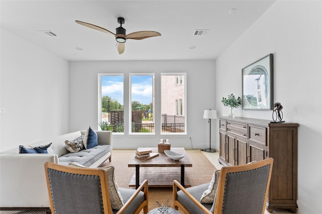 living area featuring ceiling fan