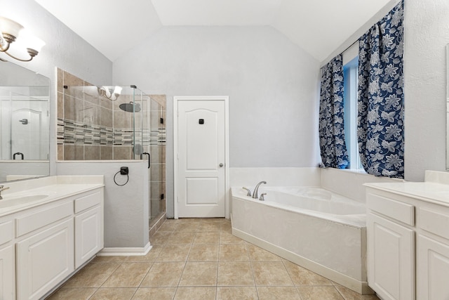 bathroom with tile patterned floors, vanity, plus walk in shower, and vaulted ceiling