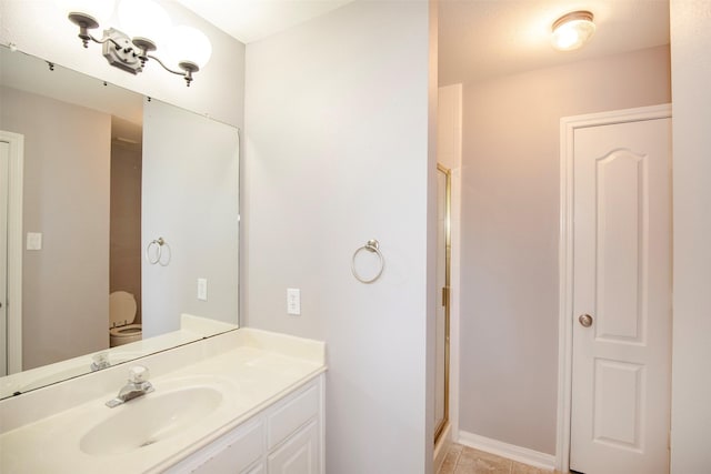 2109 Enchanted Lake Dr, League City, TX 77573 - full bath featuring a stall shower, vanity, toilet, and baseboards