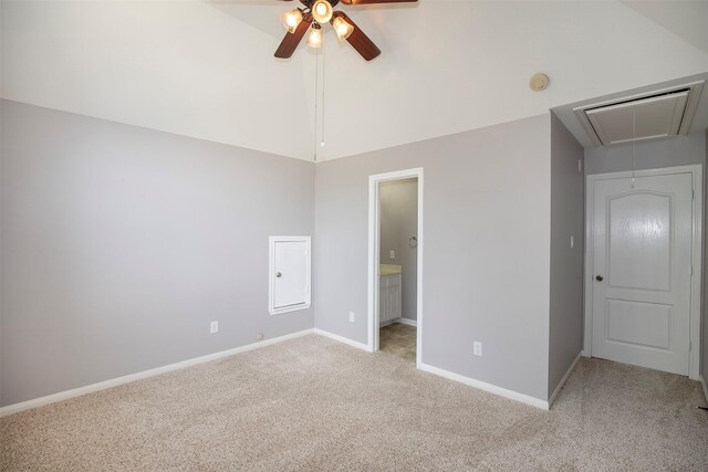 2109 Enchanted Lake Dr, League City, TX 77573 - unfurnished bedroom with attic access, light colored carpet, baseboards, high vaulted ceiling, and connected bathroom