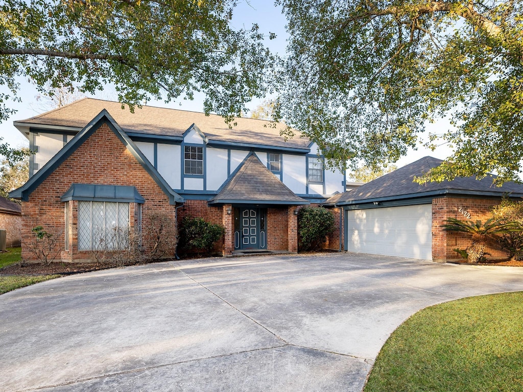 tudor-style house with a garage